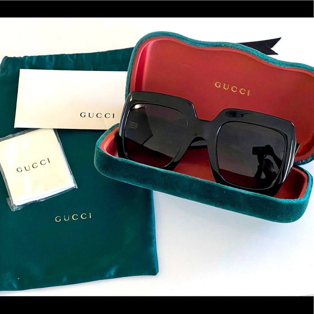 Gucci black square glasses with gold logo.